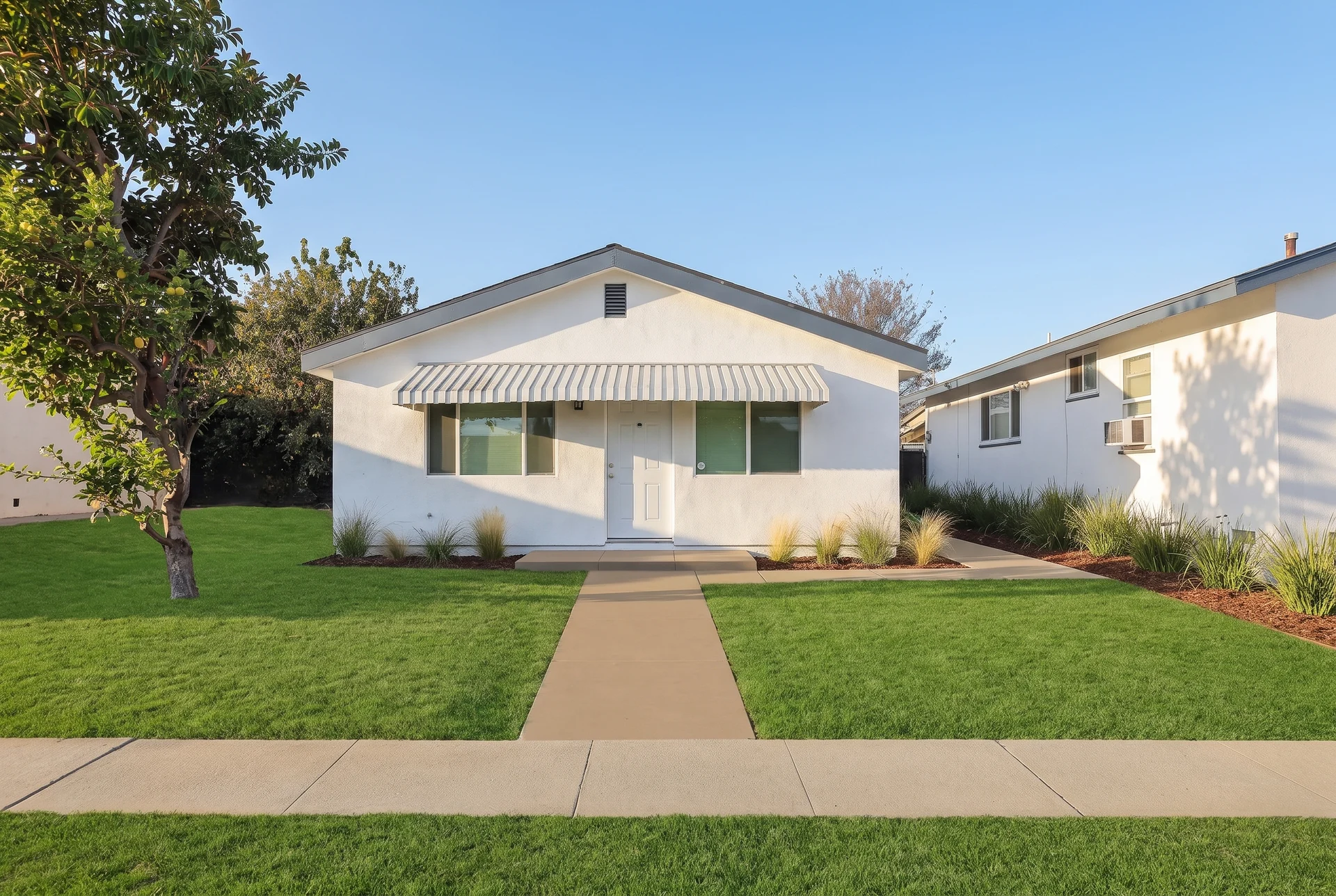 AI-enhanced visualization of Avorino's detached ADU in Buena Park, with a tidied lawn and finished landscaping